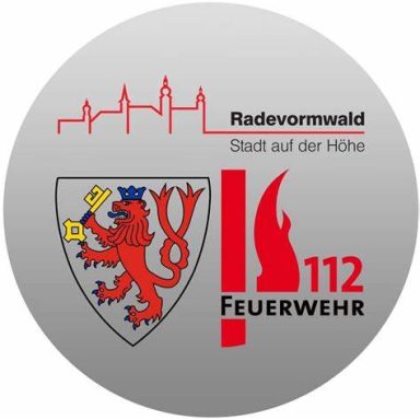 Logo von Radevormwald mit Feuerwehrsymbol und Wappen eines Löwen.